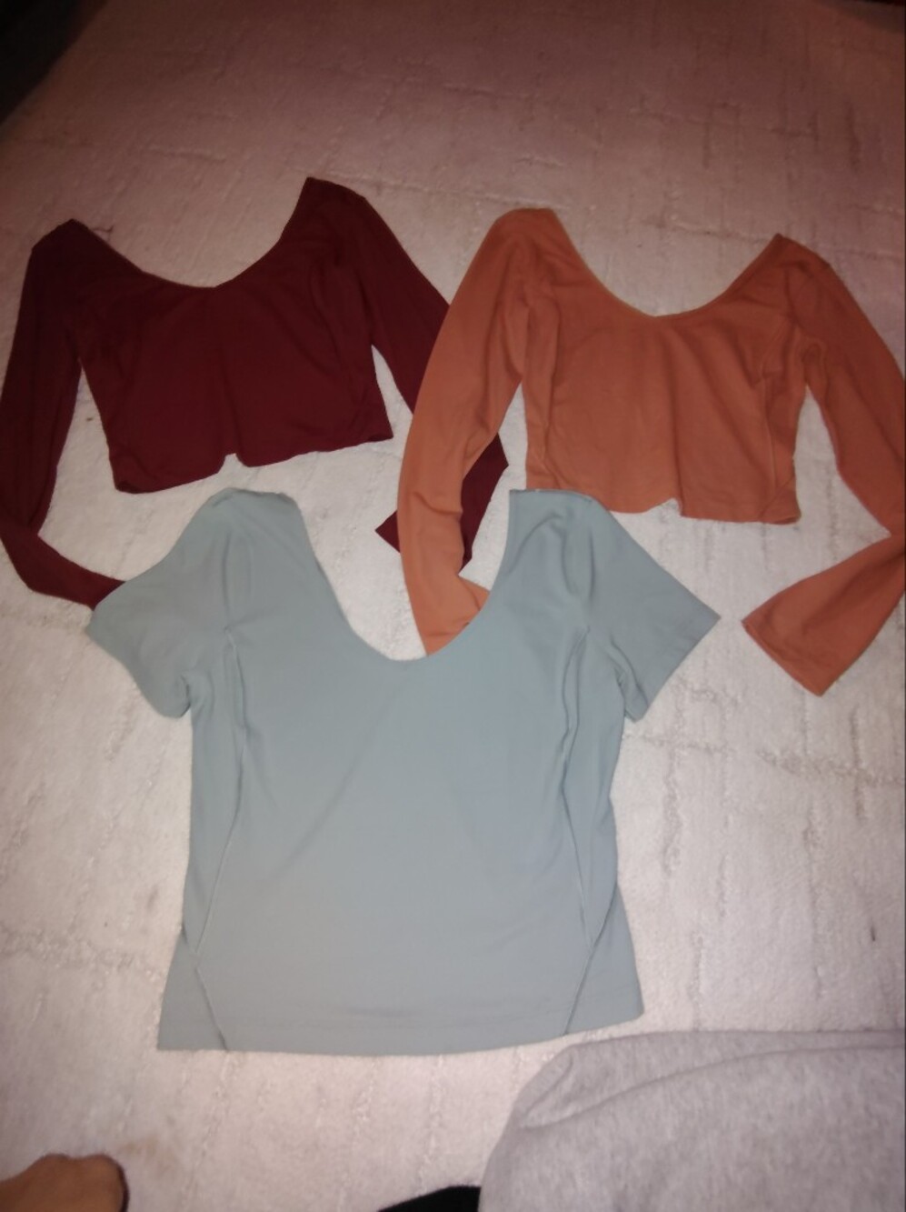 lululemon athletica Scoop Neck Crop Tops in Light Blue, Rust, and Burgundy